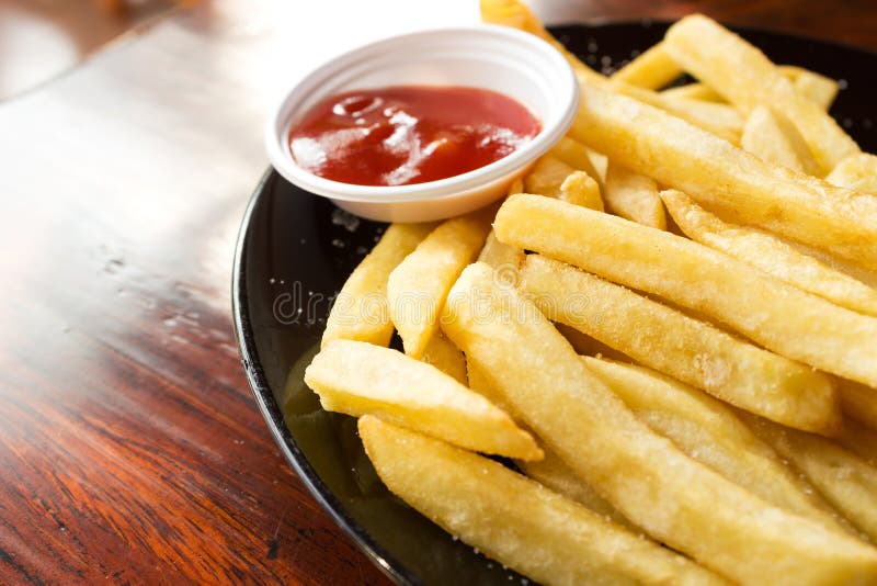 French fries with ketchup. stock photo. Image of yellow 48782620