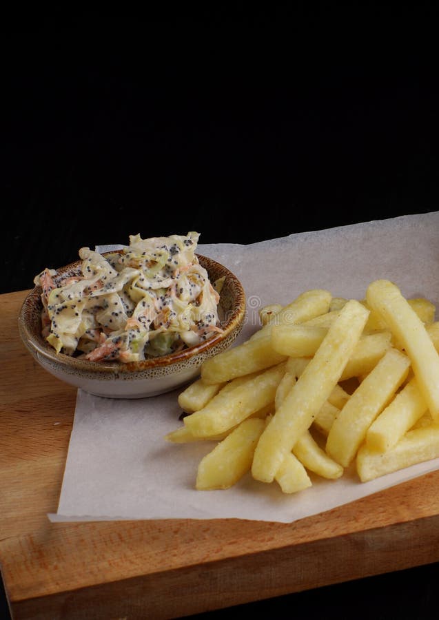 French Fries and Salad with Mayonnaise on the Board Stock Photo Image