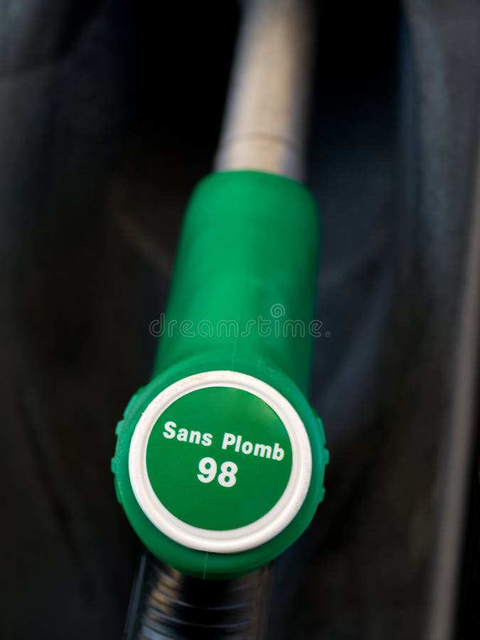 French green unleaded 98 gas pump closeup with black background