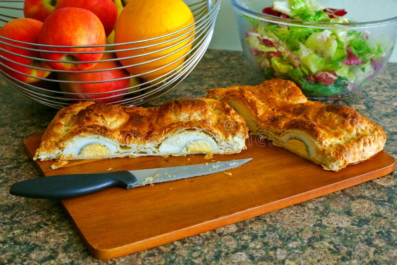 Sliced open home baked pastry egg pie. stock image