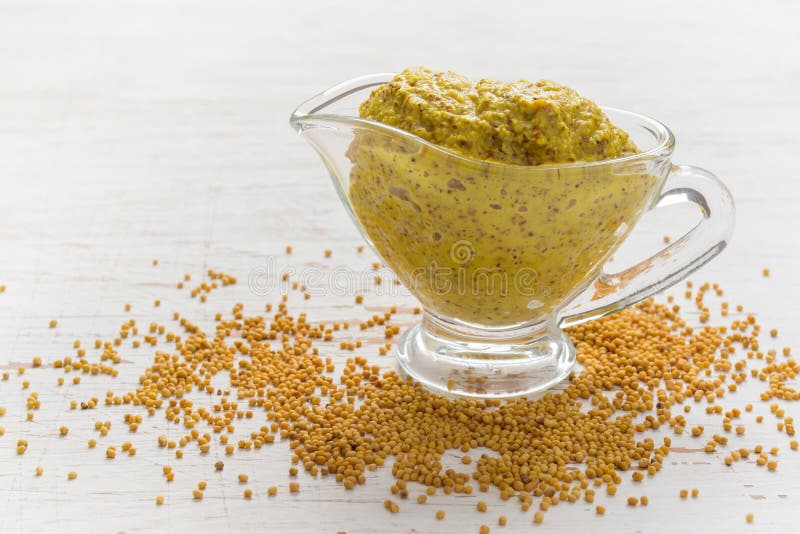 French Mustard Sauce and Mustard Seeds on White Background. Top Stock