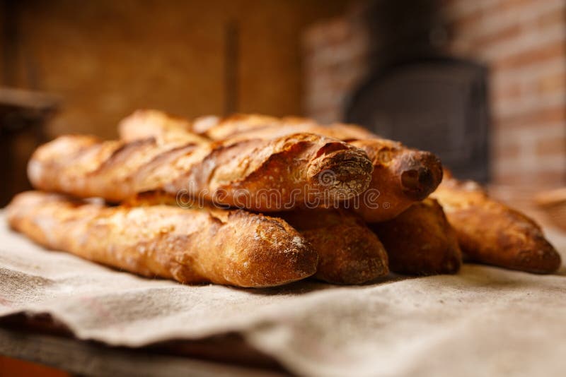 French Organic Baguettes in Authentic Bakery Setting Stock Photo