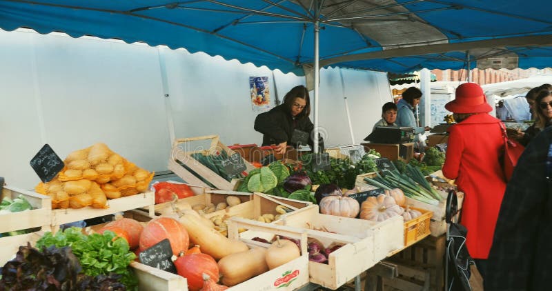 Fruit Stall With People Buying At Morlaix Weekly Market France