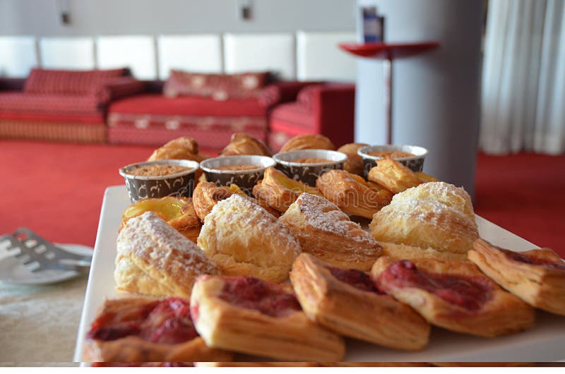 French pastry. Croissants and cupcakes stock photo