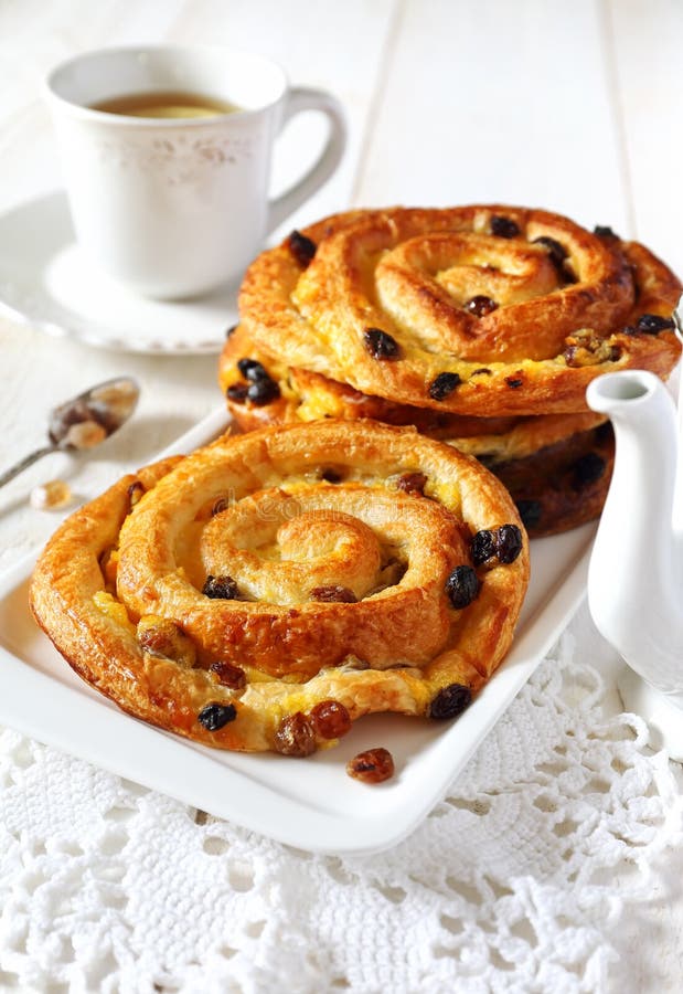 French Raisin Pastries on a Wicker Trail and White Background Stock