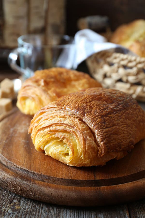 French Breakfast Sweet Puff Pastry Bun and Cup of Coffee Stock Photo