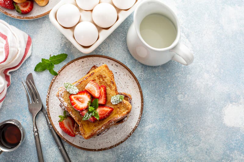 French toasts with strawberry and powdered sugar