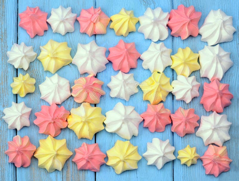 French Vanilla Meringue Cookies on Blue Background. Stock Photo - Image