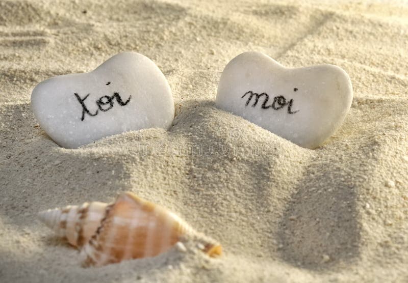 French you and me hearts of pebbles in the sand