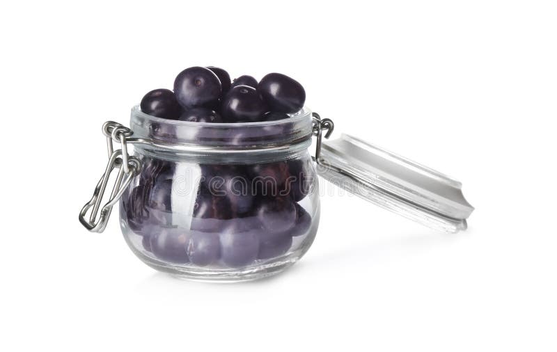Fresh acai berries in glass jar isolated on white