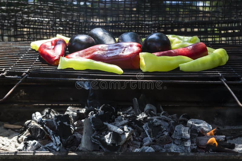 Fresh Anaheim Chili Peppers Roasting Over a Charcoal Fire Stock Photo