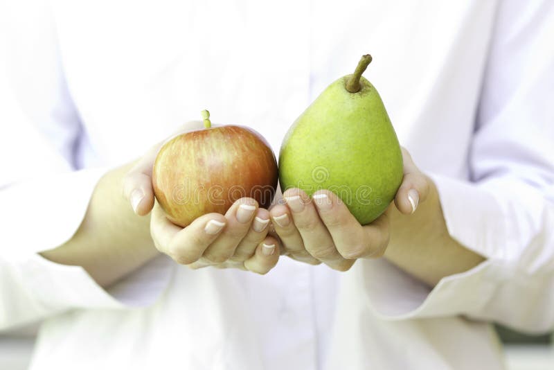 Fresh apples in woman s hands.