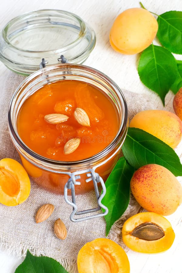 Homemade Apricot Jam in Glass Jar and and Ripe Apricots. Homemade Jam