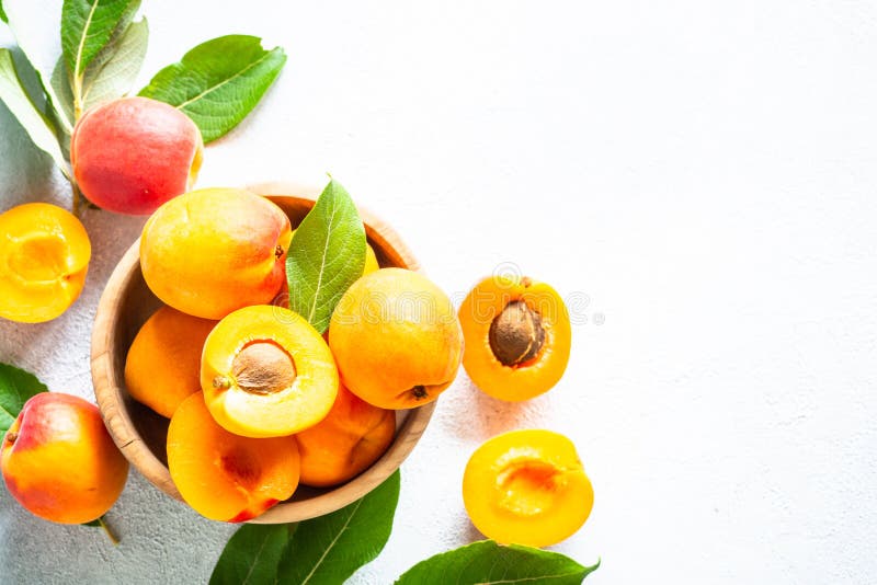 Fresh Apricots with Green Leaves at White. Stock Photo Image of natural, white 266978748