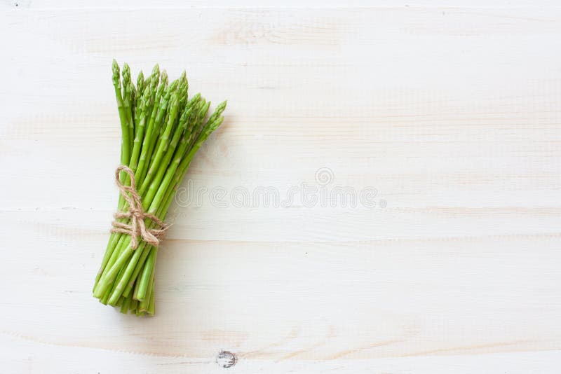 Fresh asparagus on white wood background royalty free stock image Fresh asparagus on white wood background royalty free stock image