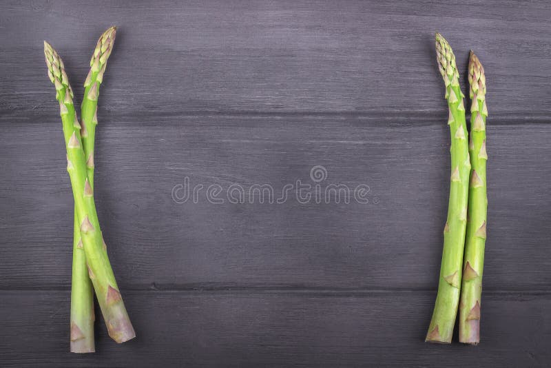 Fresh asparagus on wooden rustic background. Copy space stock photo Fresh asparagus on wooden rustic background. Copy space stock photo