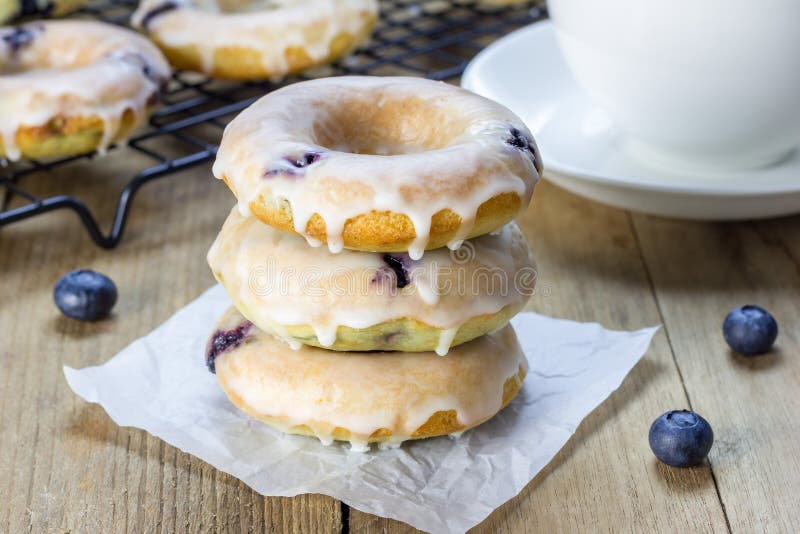 Fresh Baked Doughnuts with Blueberries and Lemon Glaze, for Breakfast
