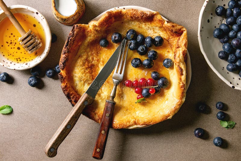 Dutch baby with berries stock photo. Image of dessert ...