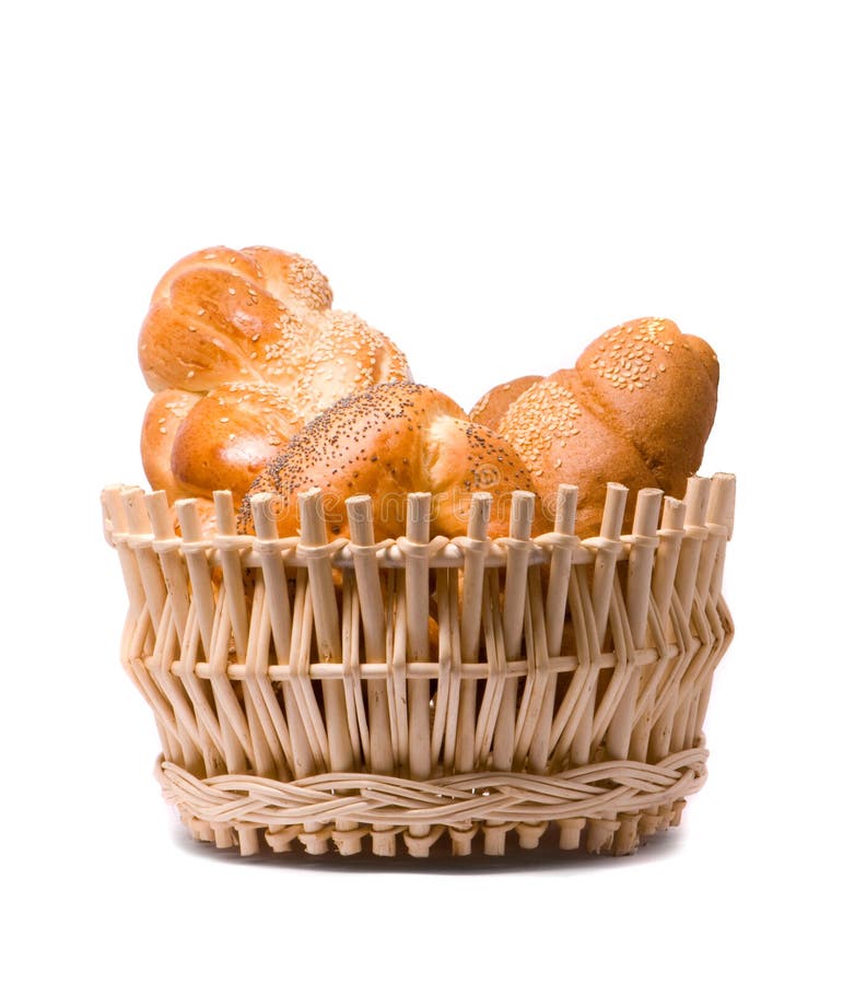 Fresh baked rolls in a basket on white