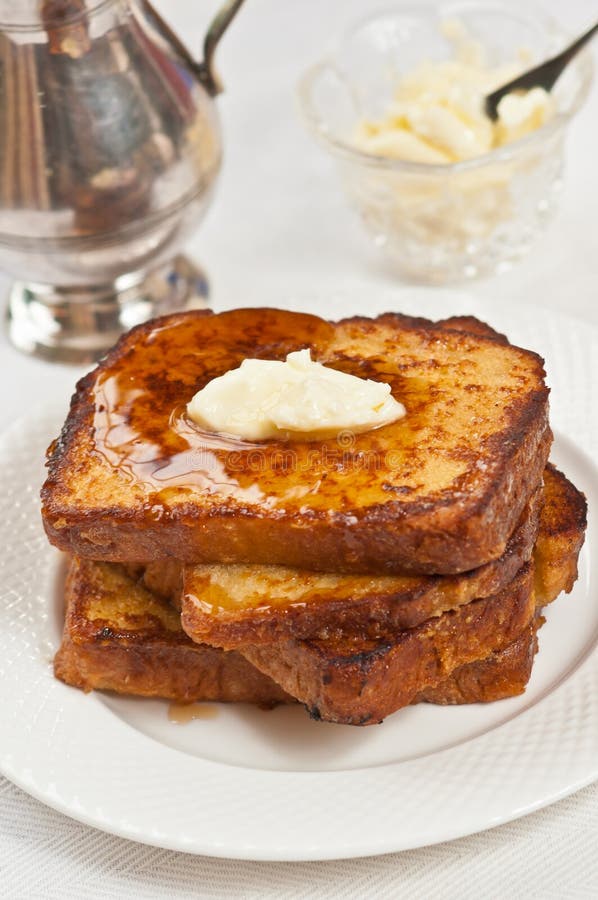 Fresh, baked stack of french toast with melting butter