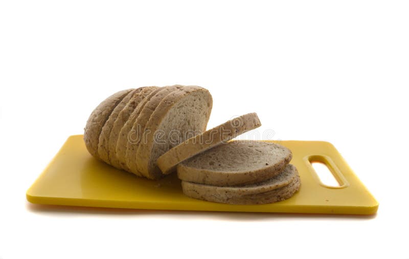 Whole Grain Bread and Sliced Bread on Plastic Cutting Board Isolated on