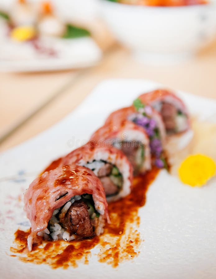 Japanese Wagyu Beef Sushi Maki Rolls on Ceramic Plate Stock Photo ...