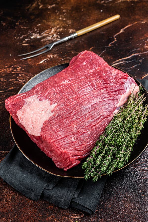 Fresh Beef Brisket, Raw Meat with Herbs. Dark Background Stock Image