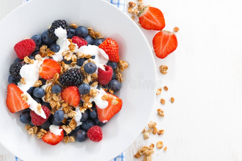 Fresh berries, yogurt and homemade granola for breakfast