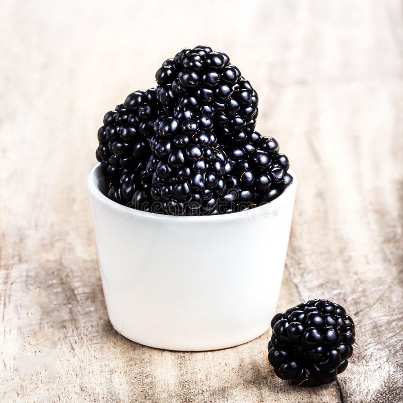 Fresh Blackberries in a White Bowl on Wooden Stock Photo - Image of ...