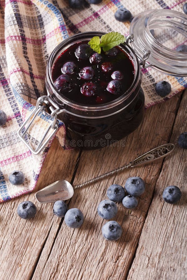 Fresh Blueberry Marmalade in a Glass Jar Close Up. Vertical Stock Image