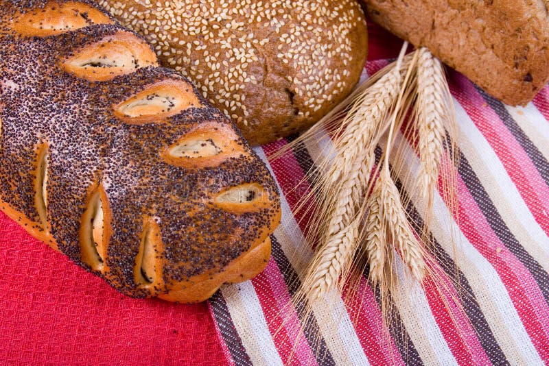 Fresh bread with ears of wheat