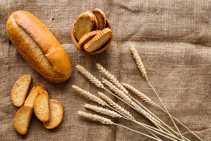 Download Fresh Bread With Wheat Flour In Bakery Shop On Linen Desk Background Top View Mock-up Stock ...