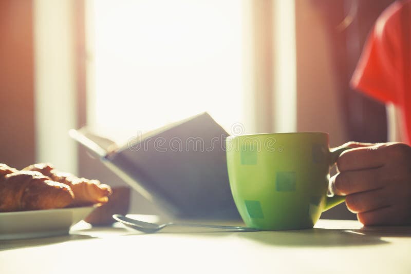 Fresh breakfast with hot coffee and book royalty free stock images