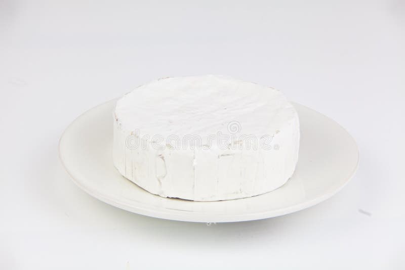 Fresh Brie Cheese with White Mold on a White Background Stock Image