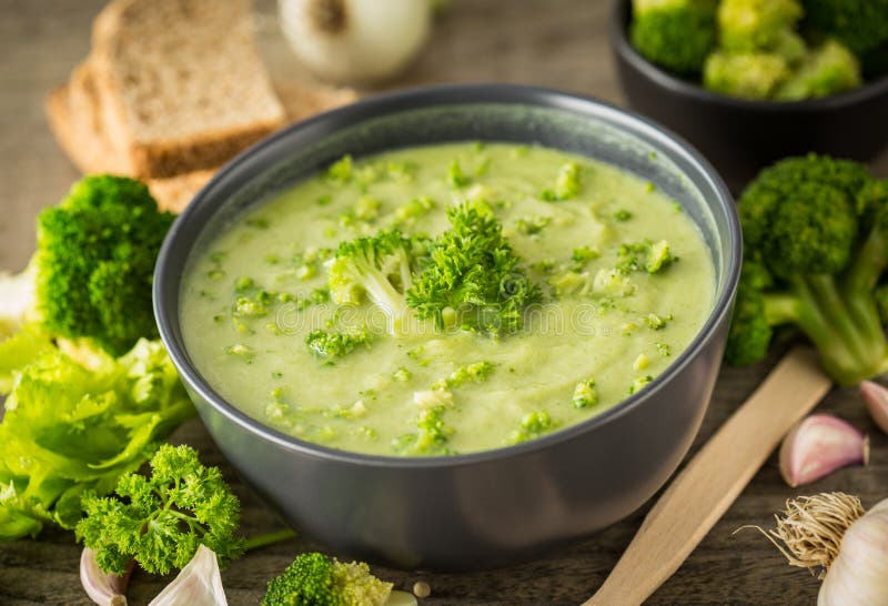 Fresh broccoli soup on the wooden table