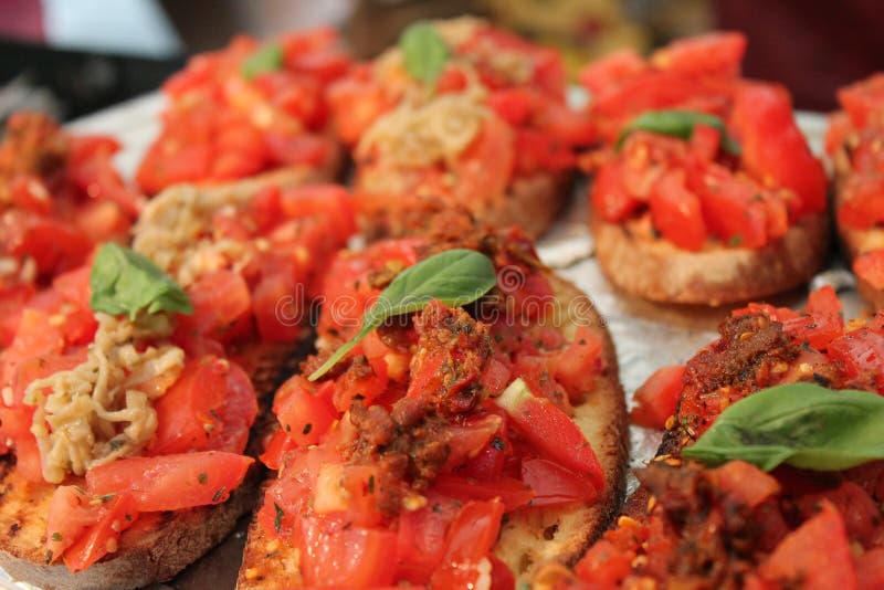 Bruschetta, Toast With Soft Cheese, Basil And Tomatoes On A White