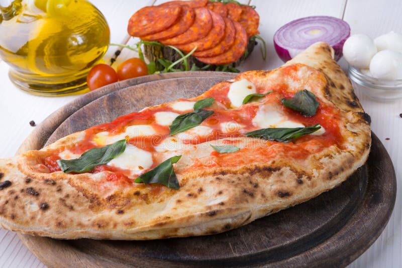 Calzone pizza stock image. Image of homemade, herb, knife 22039231