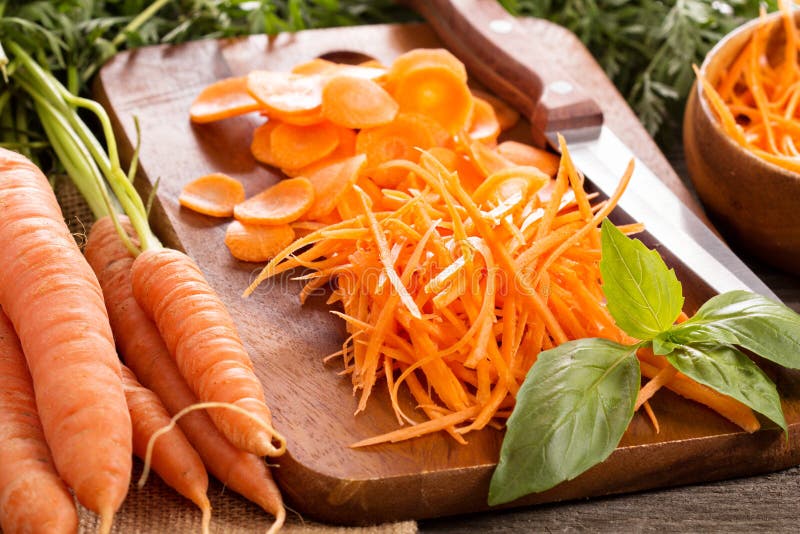Whole fresh carrots on a cutting board