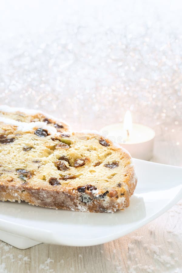 Fresh Christmas Stollen on a white plate. royalty free stock photography