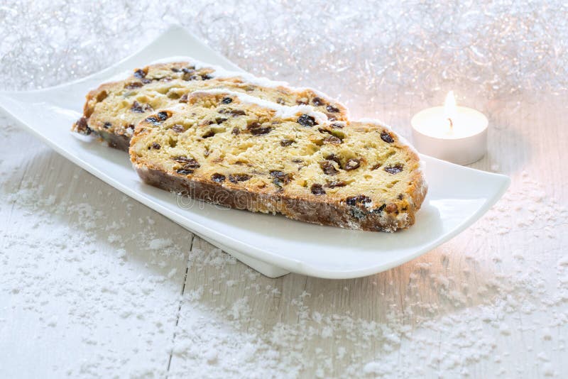 Fresh Christmas Stollen on a white plate. royalty free stock photo