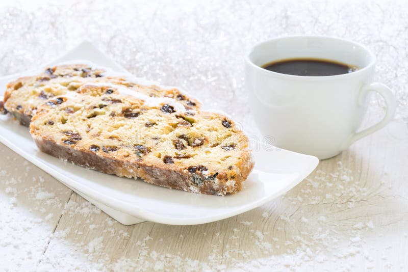 Fresh Christmas Stollen on a white plate with Coffee stock photos