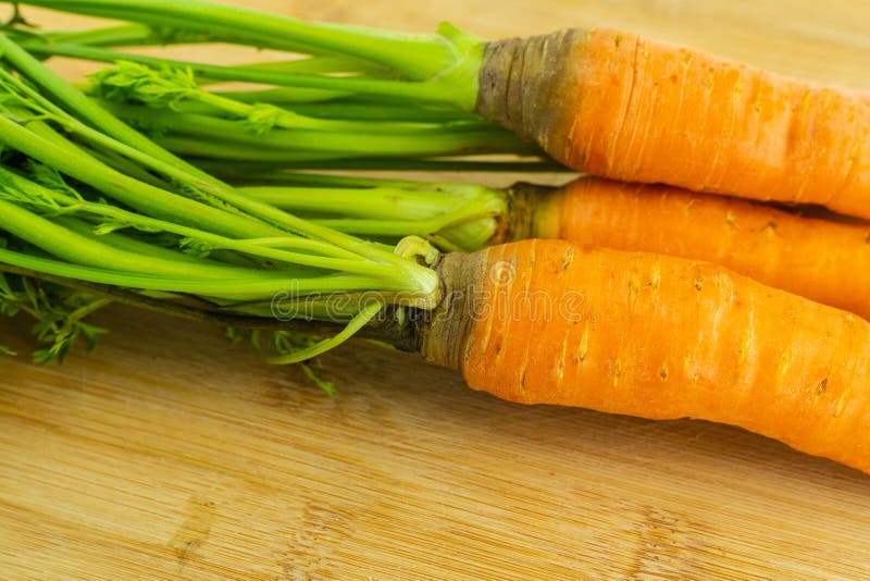 Fresh and Clean Carrots with Green Tops Closeup Vegetable Set Stock