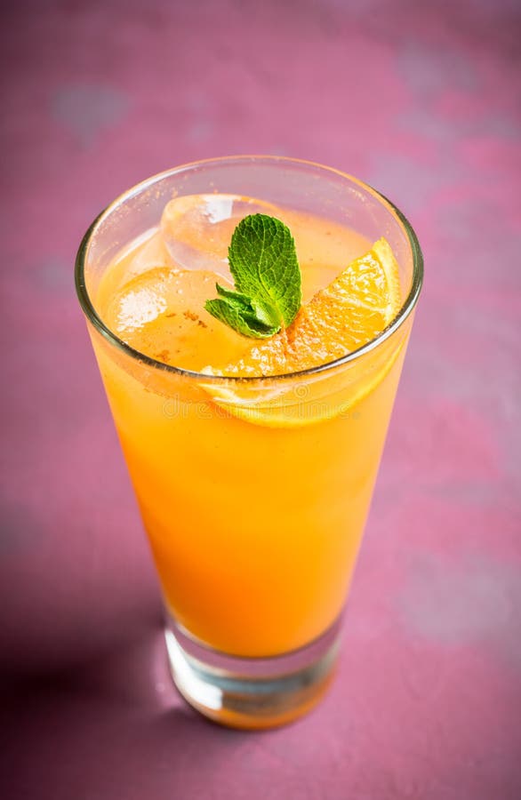 Fresh Cocktail with Vodka and Orange Juice on the Rustic Background
