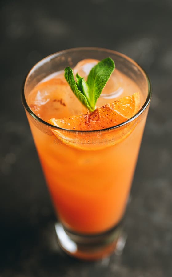 Fresh Cocktail with Vodka and Orange Juice on the Rustic Background