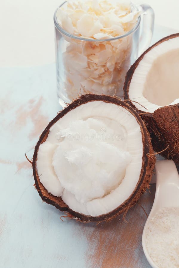 Fresh Coconut Split in Half, Coconut Oil and Flakes Stock Photo Image