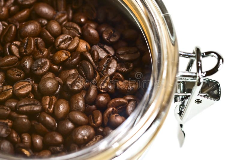 Fresh coffee beans in airtight stock images