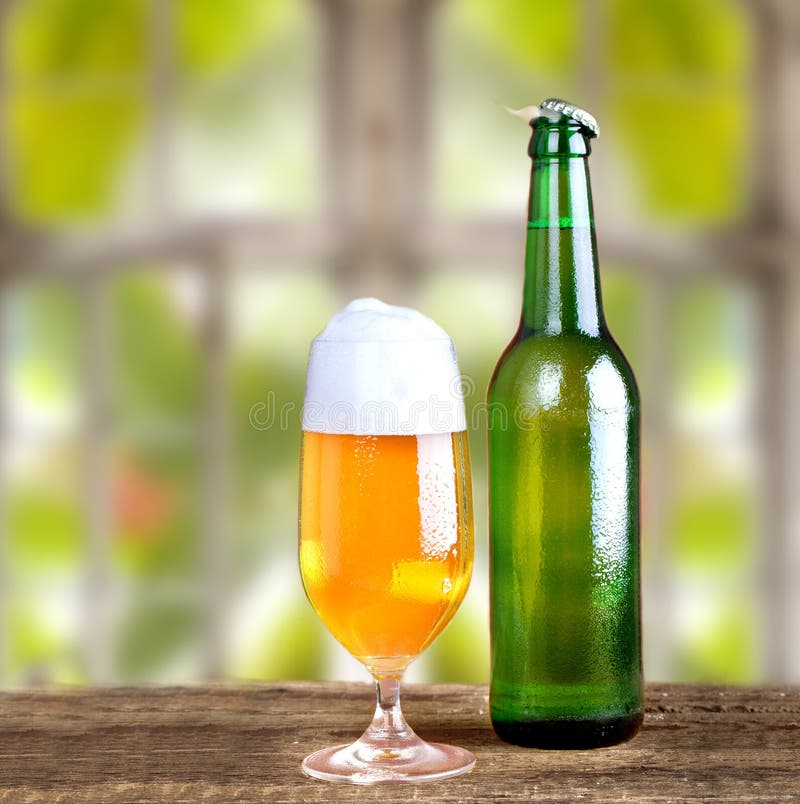 https://thumbs.dreamstime.com/b/fresh-cold-beer-glass-bottle-rustic-wooden-table-natural-background-outside-window-30957007.jpg