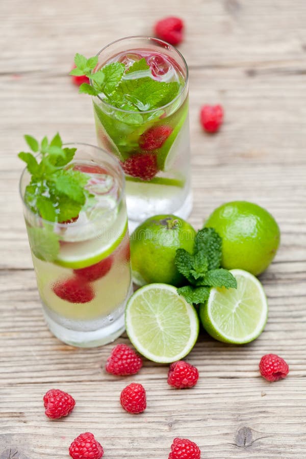 Fresh cold drink water ice cubes peppermint lime raspberry stock images