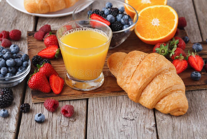 Fresh crusty croissants and orange juice for morning meals