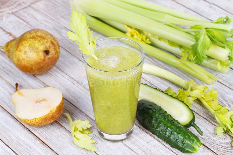 Fresh cucumber, pear and celery juice. Slices of fruits and vegetables